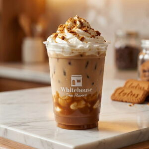 Iced Biscoff Latte with whipped cream and Lotus cookie butter crumbs