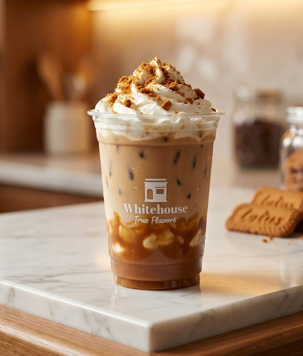 Iced Biscoff Latte with whipped cream and Lotus cookie butter crumbs